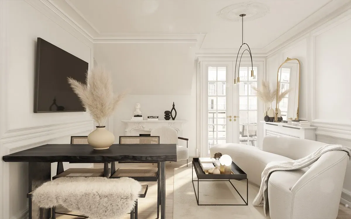 Un living cu o canapea, masă, scaune și un televizor cu ecran plat.