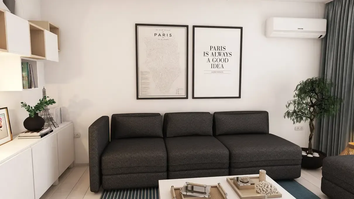 Canapea Ikea gri inchis cu masuță de cafea ce se transformă in masă de dining BoConcept.