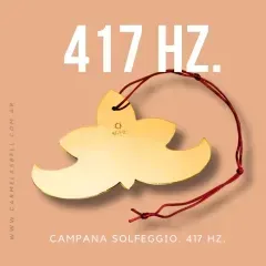Campana Solfeggio dorada con forma de flor. Cuerda roja atada, etiquetada como «417 Hz». Texto al fondo.