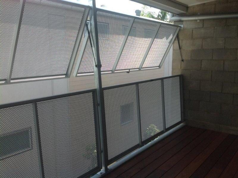 Balcony With a Metal Fence and a Wooden Floor — On The Spot Steel Fabrication in Caloundra West, QLD