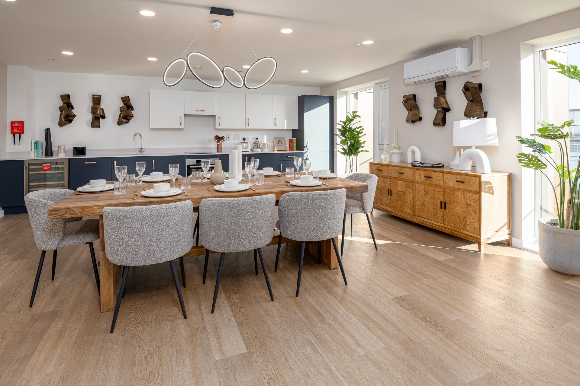 A large dining room with a long table and chairs at Walton Court.