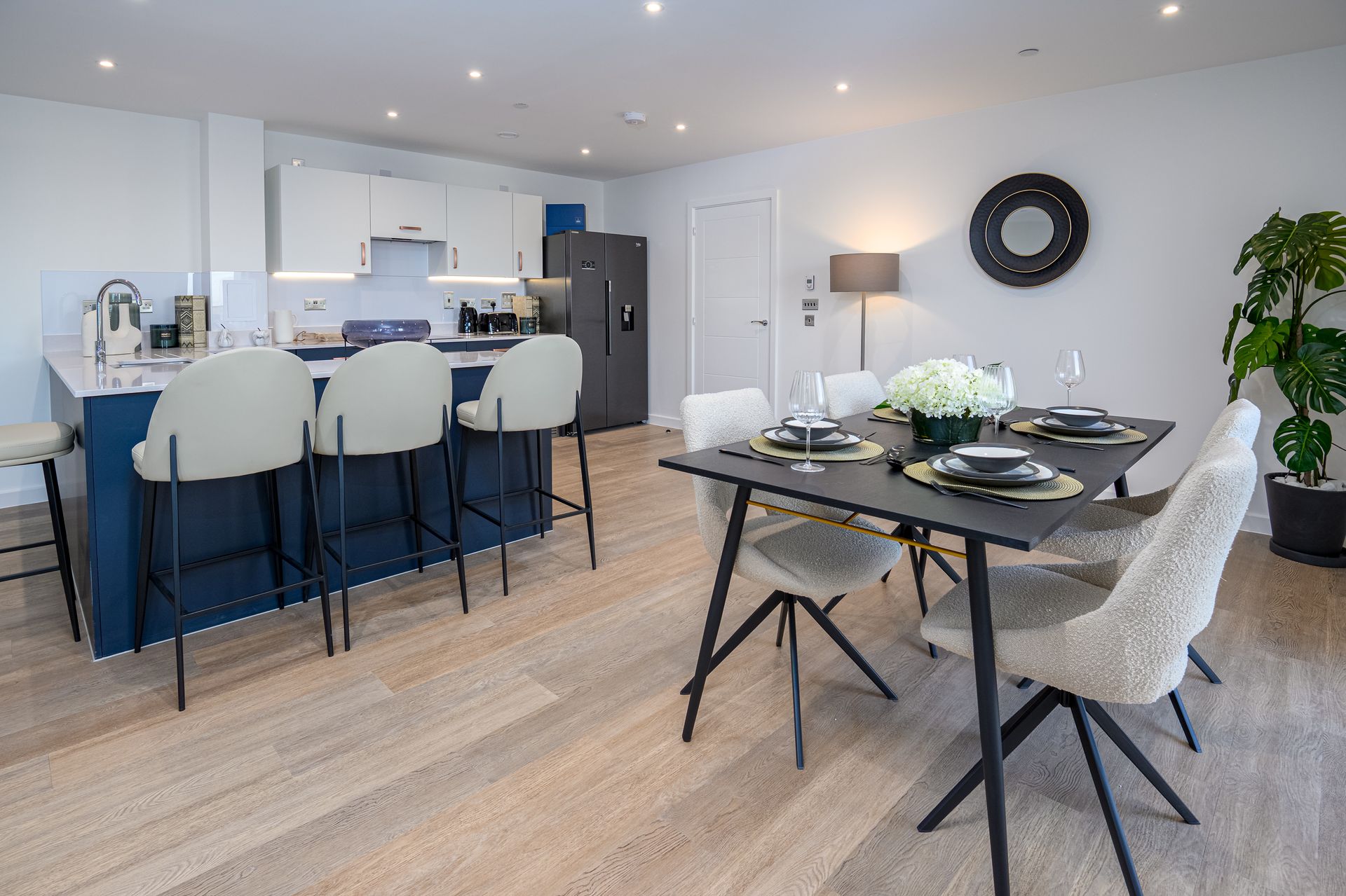 A kitchen and dining room in a house with a table and chairs at Walton Court.