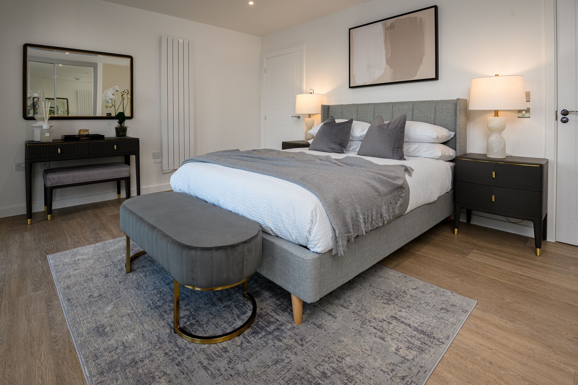 There is a large bed in the middle of the room at Walton Court.