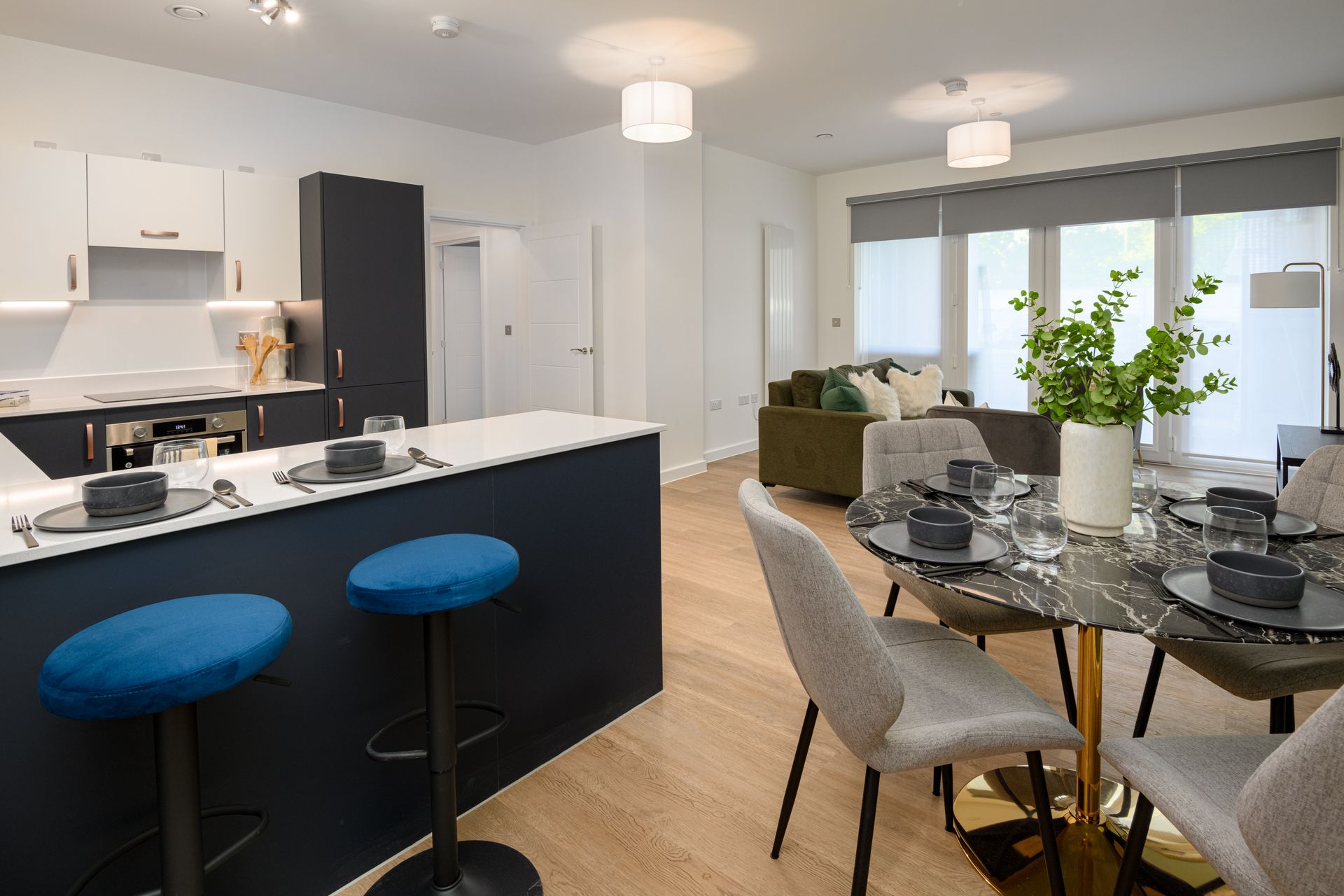 A kitchen and dining room in a house with a table and chairs at Walton Court.
