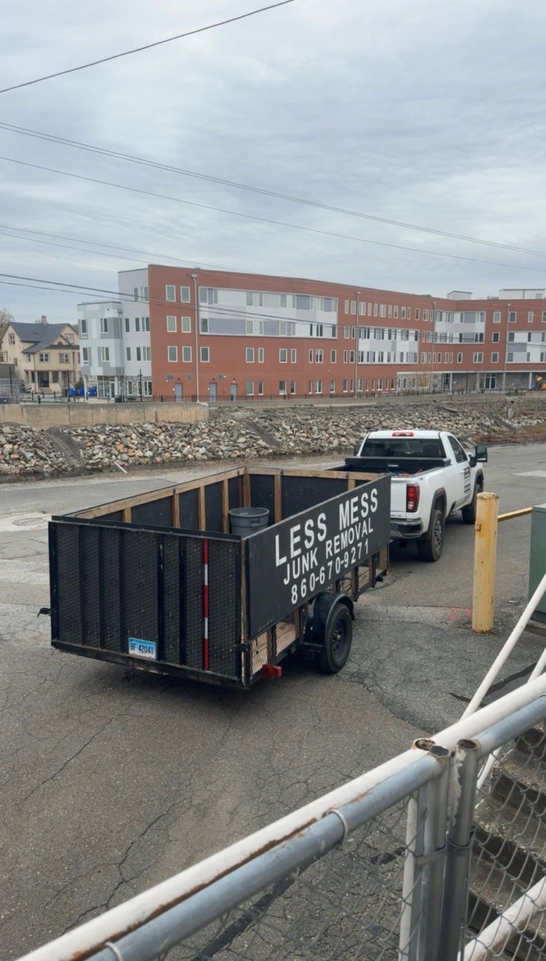 Truck pulling a black trailer with 