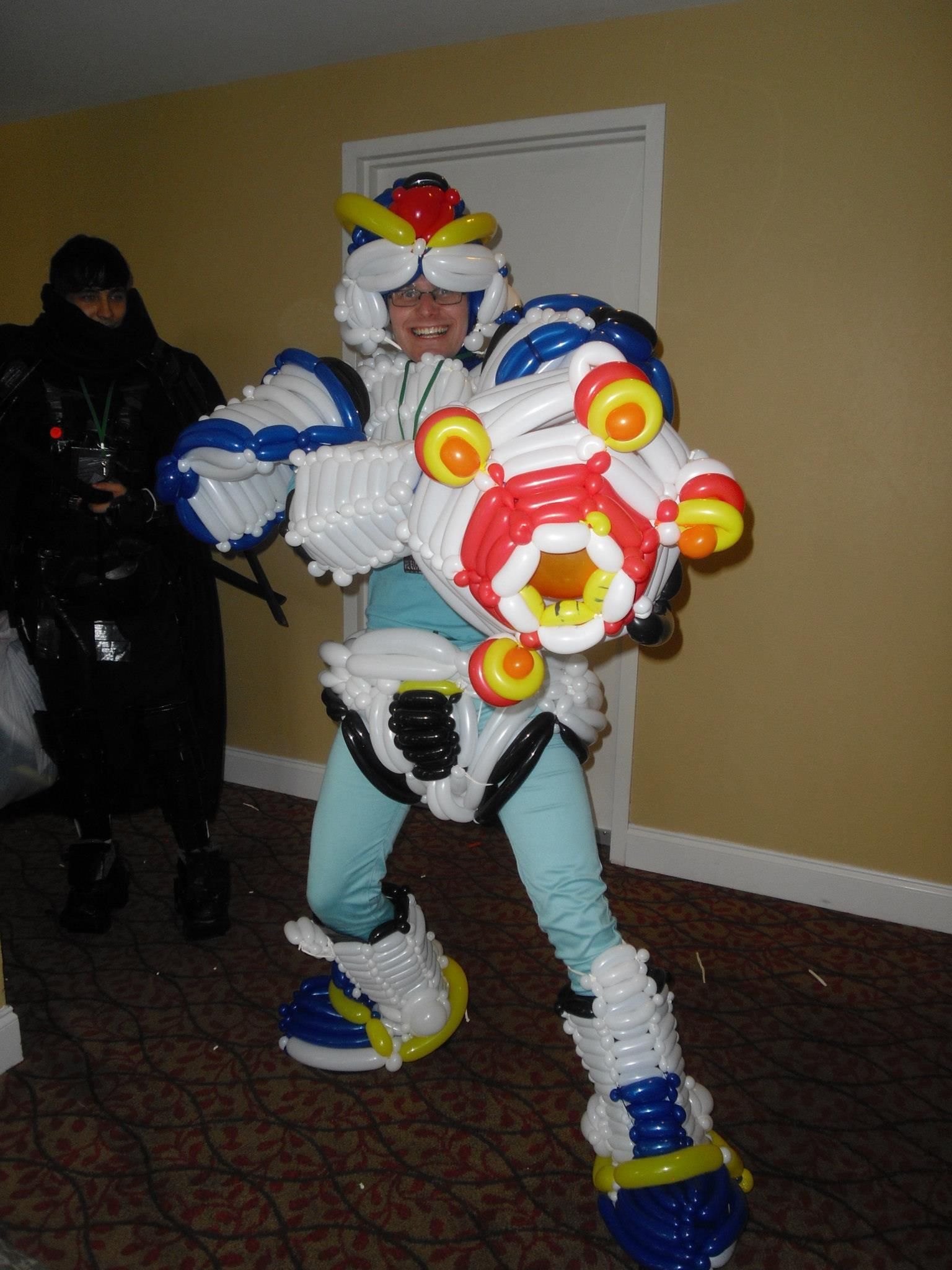 A person in a robot costume made of balloons