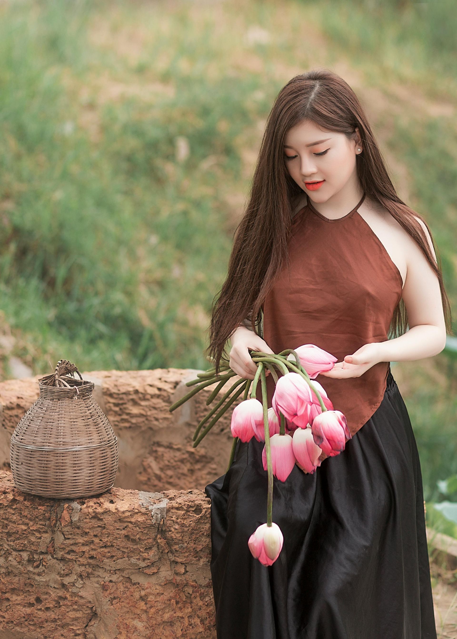 Woman in nature with flowers