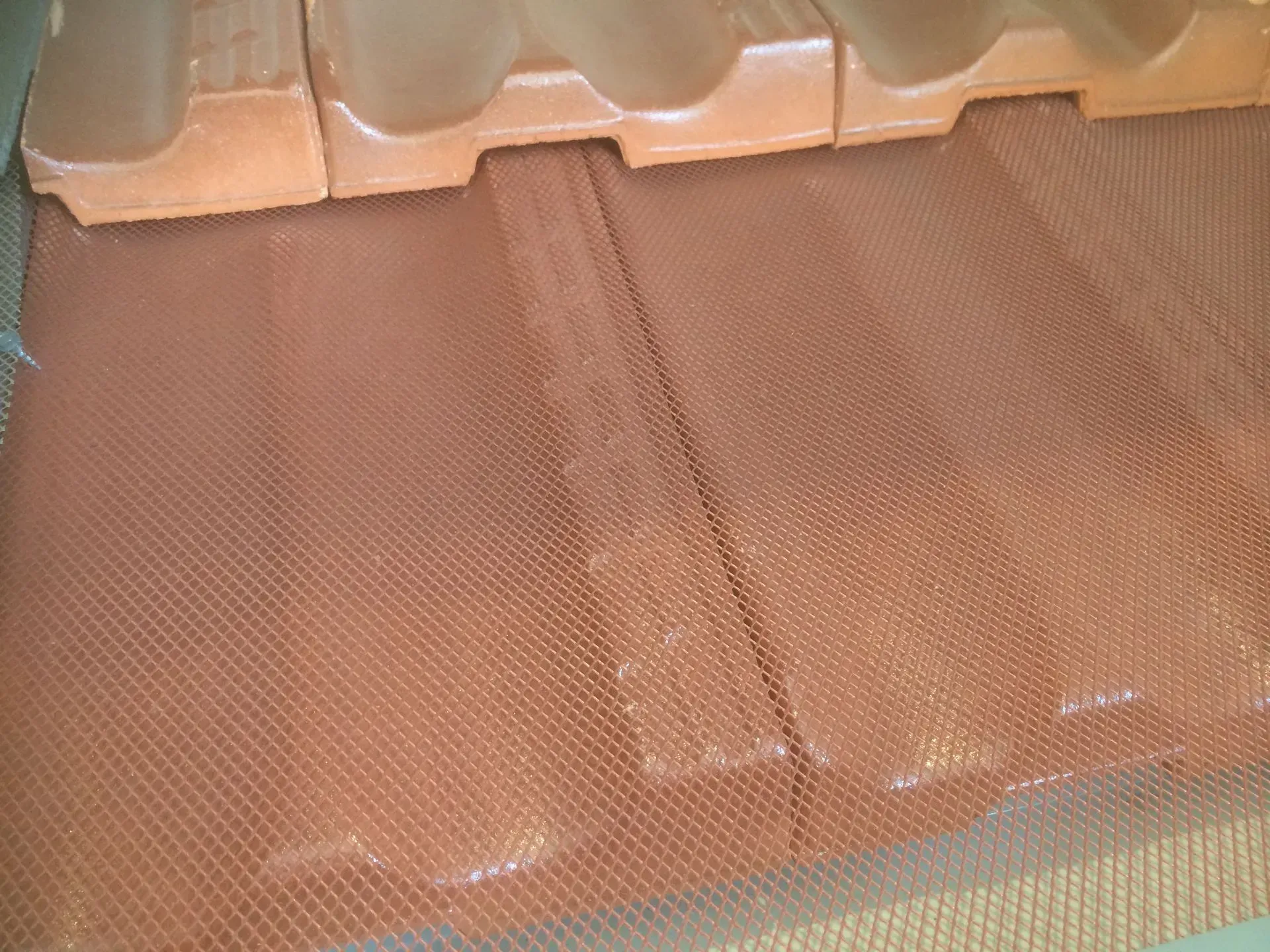 tile roof gutter with mesh installed