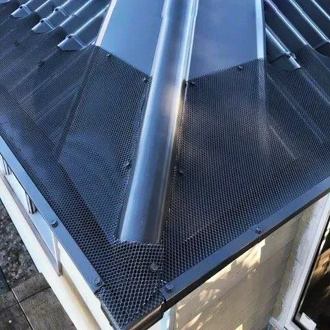 another shot of successful All-Flow Gutter Guard installation on metal roof corner