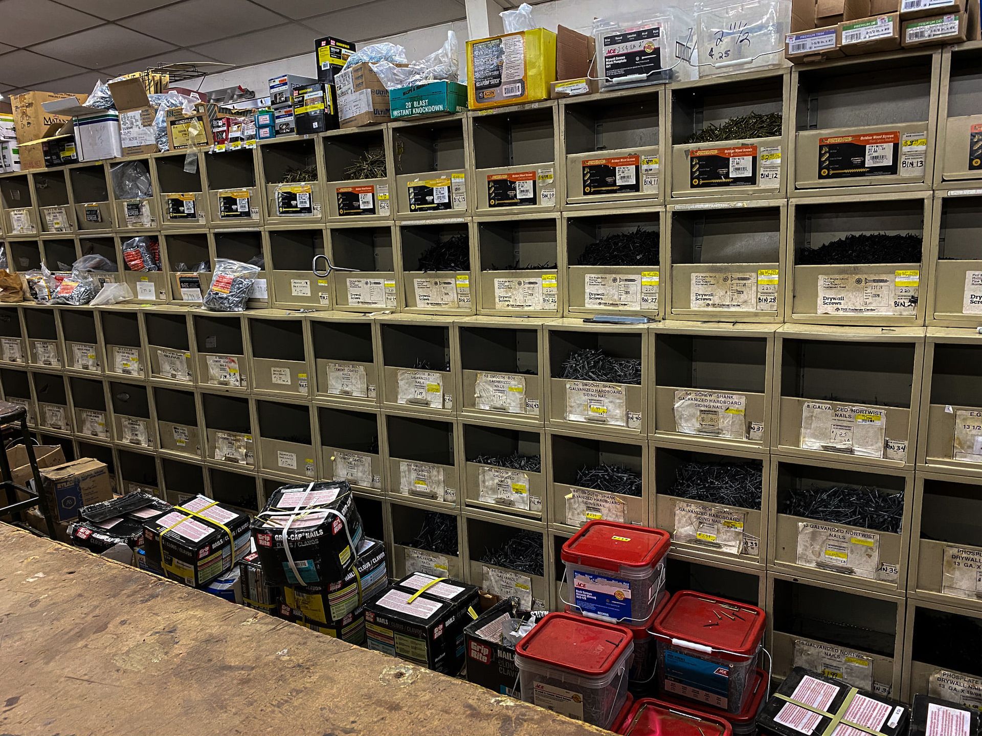 A warehouse filled with lots of shelves filled with lots of different types of tools.