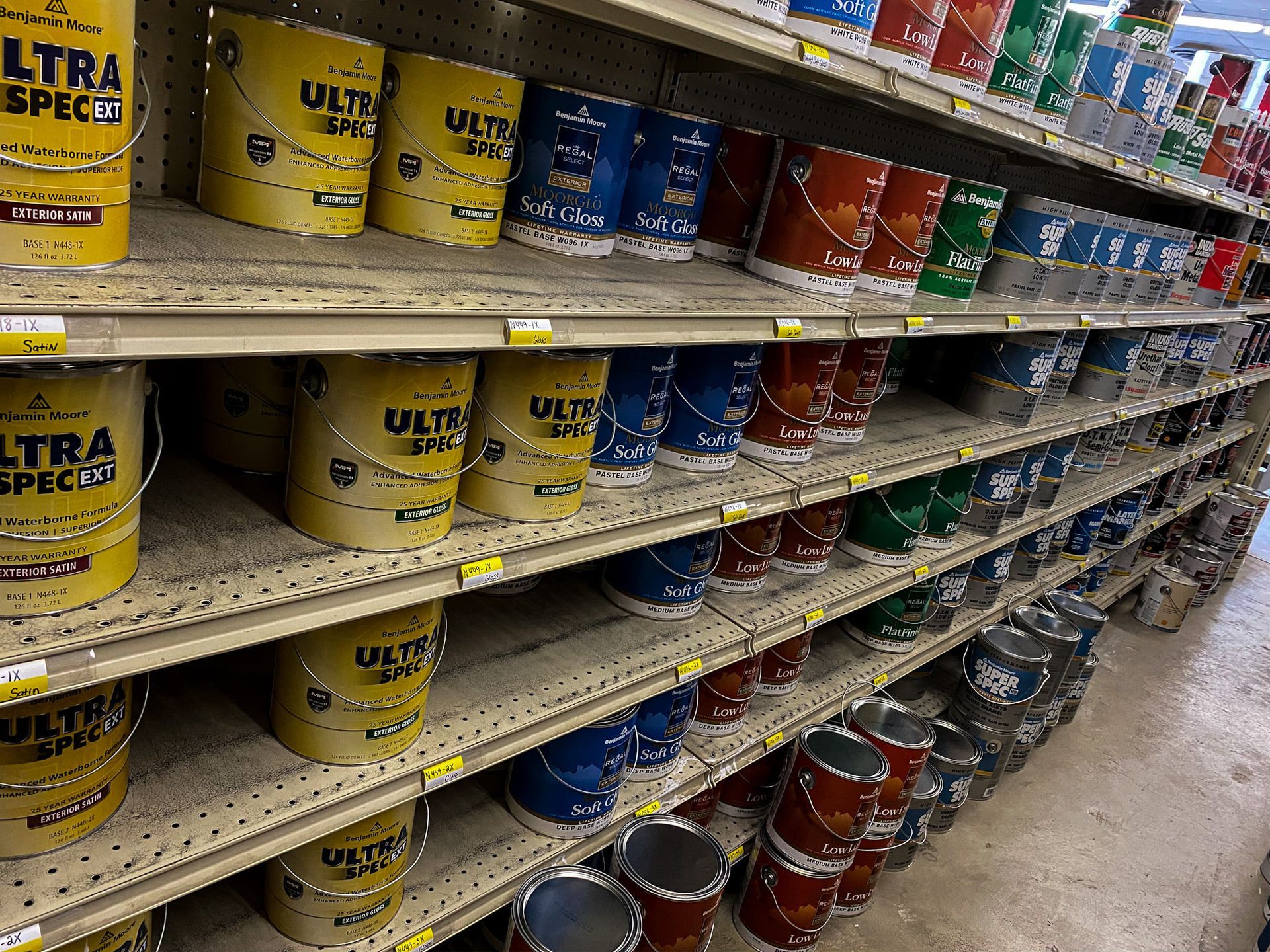 Shelves filled with buckets of ultra spec paint