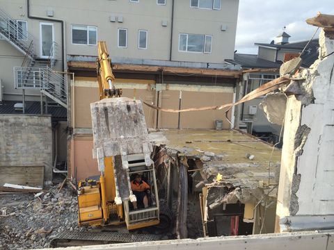 Demolition being done with the help of machine