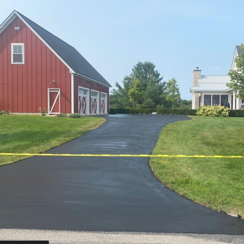 Expertly Applied Asphalt Sealcoating to Preserve Your Pavement in Traverse City and Beyond