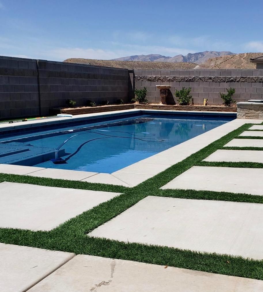 A large swimming pool with mountains in the background