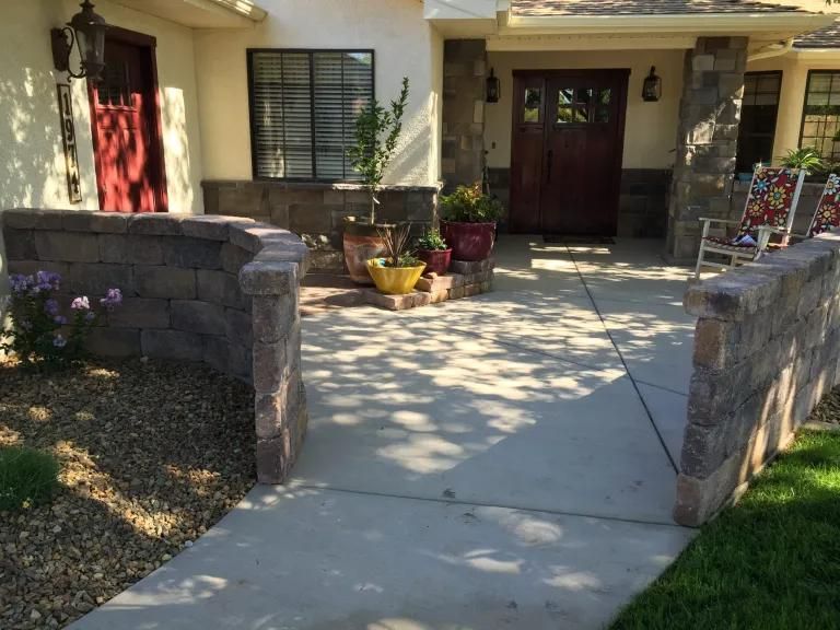 A walkway leading to the front door of a house