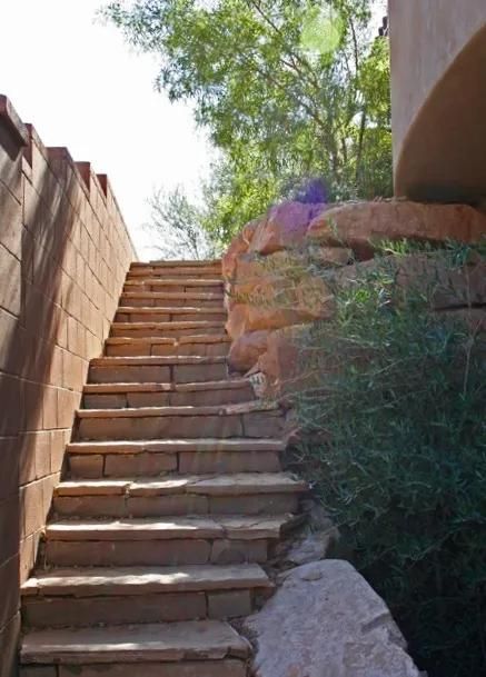 A set of stone stairs leading up to a building