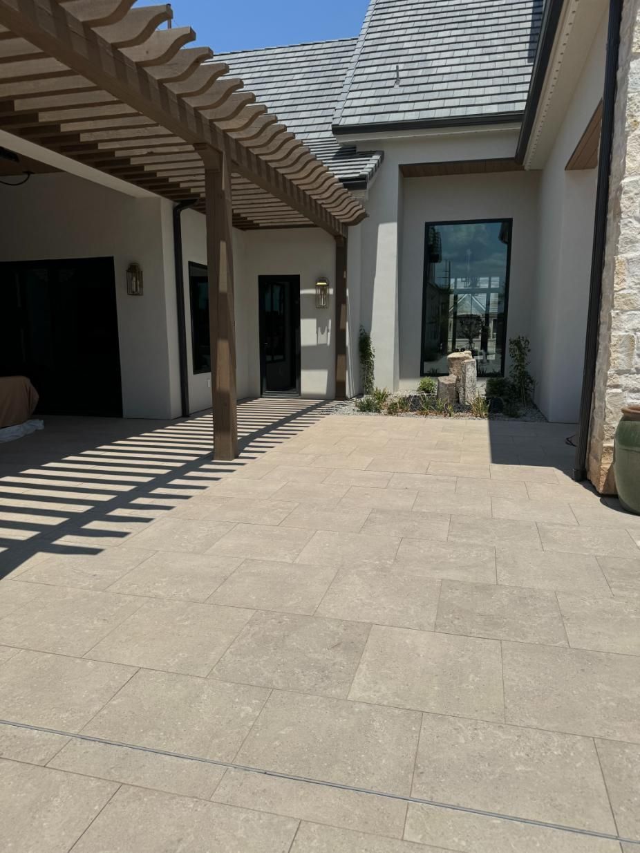 A house with a pergola on the side of it