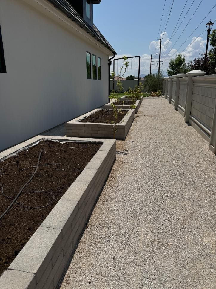 A row of planters on the side of a house