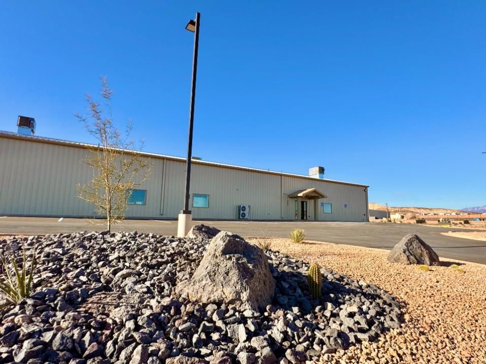 A large building with a lot of rocks in front of it.