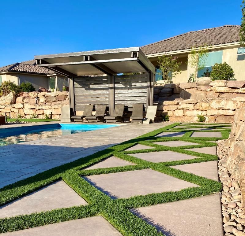 A house with a swimming pool in front of it