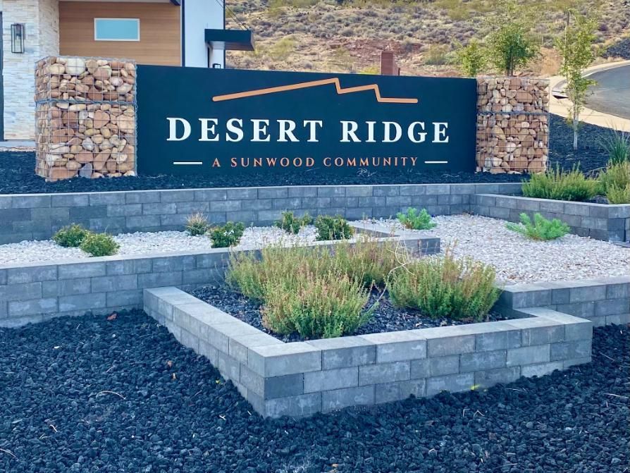 A sign for desert ridge a sunwood community