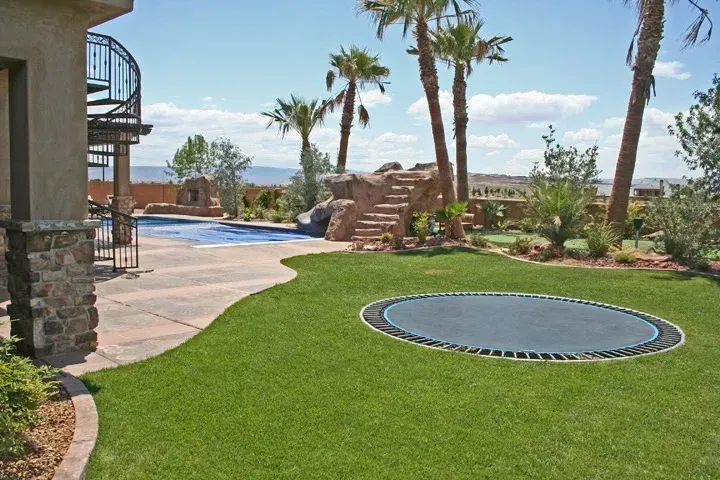 A drawing of a house with a pool and trees