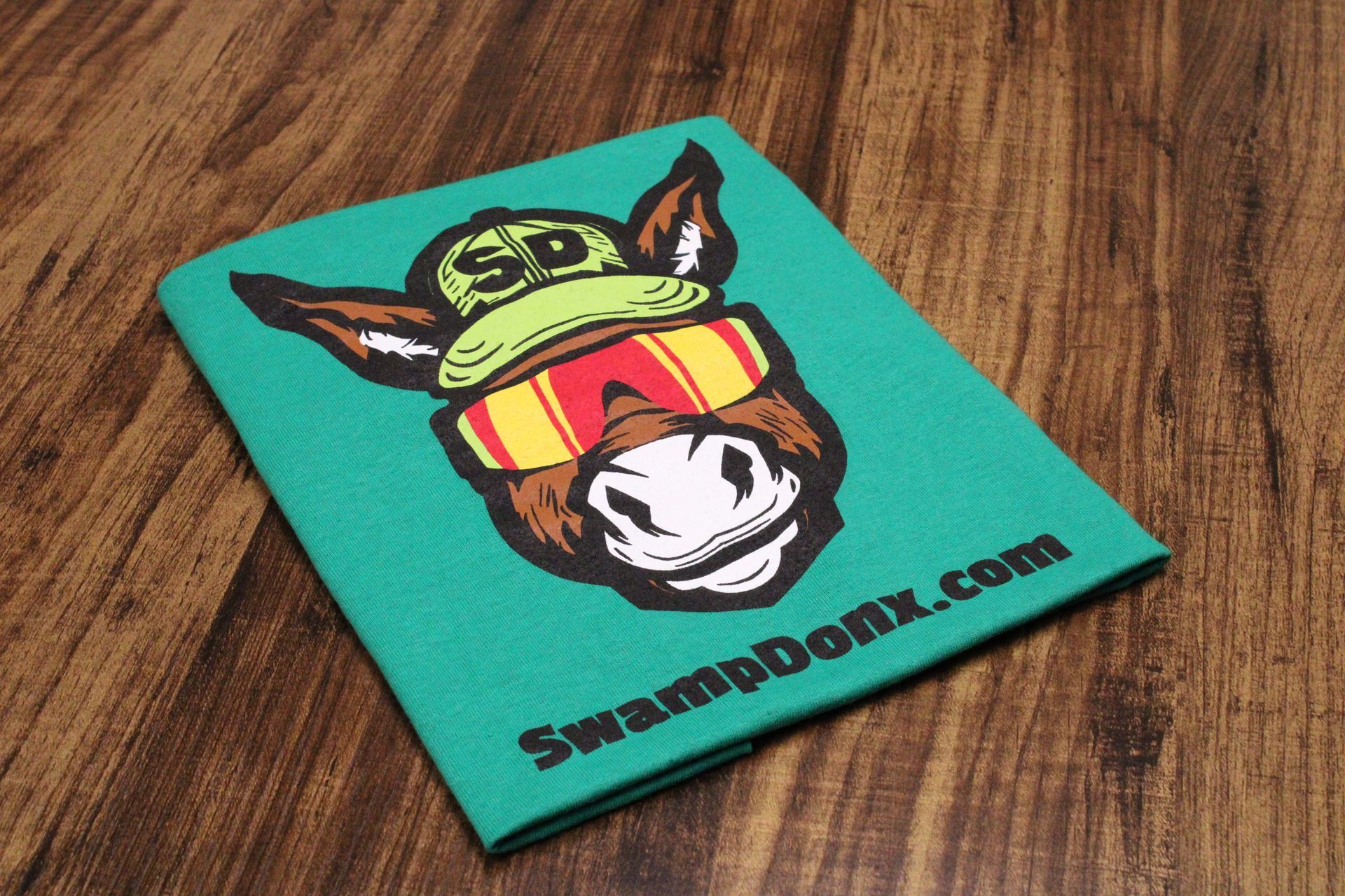 Four shirts with donkeys on them are stacked on top of each other