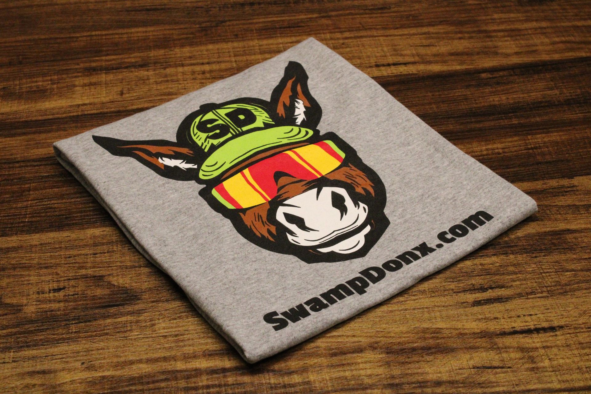 Four shirts with donkeys on them are stacked on top of each other