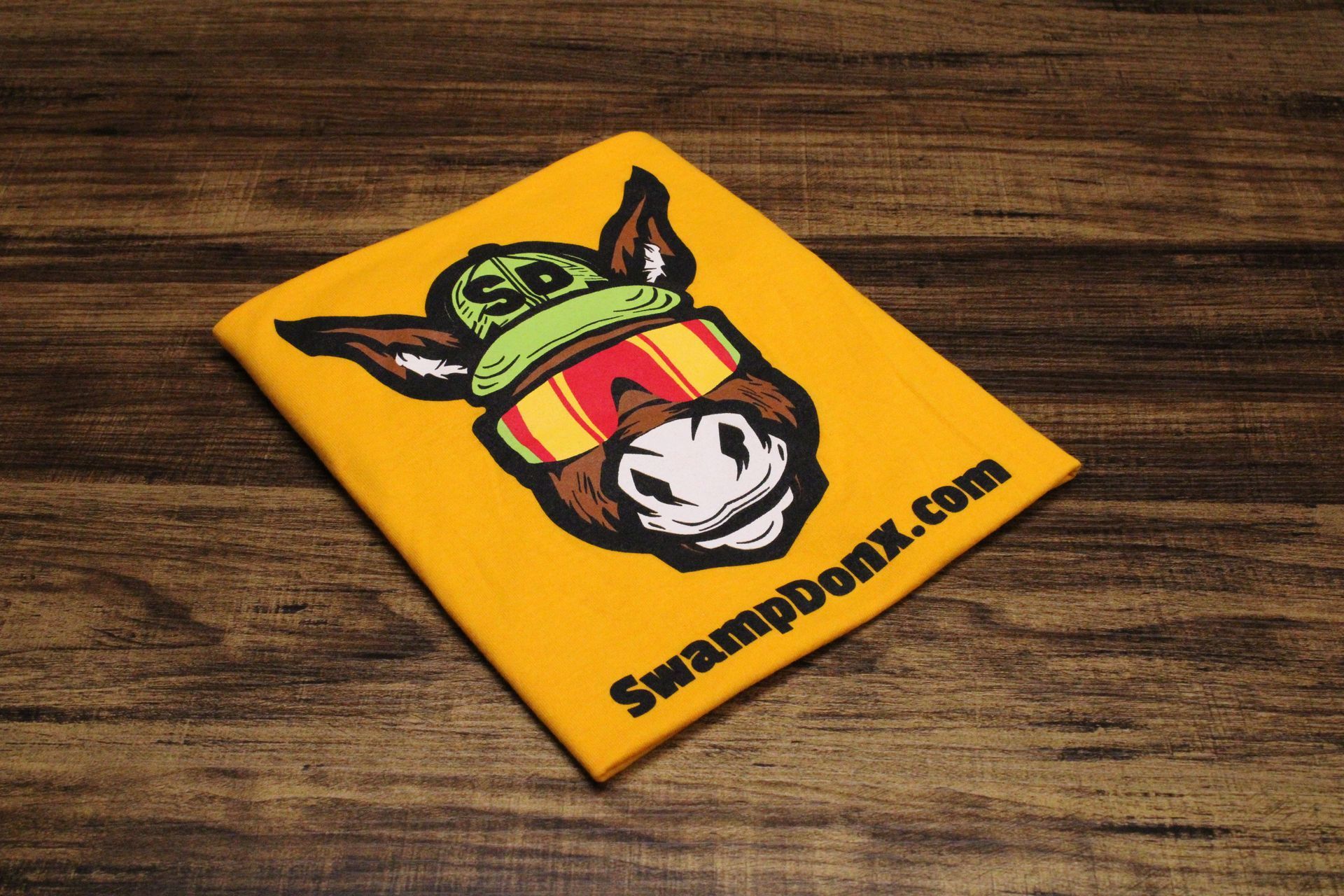 Four shirts with donkeys on them are stacked on top of each other