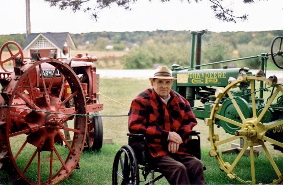 Palm trees against a light blue and yellow sky.