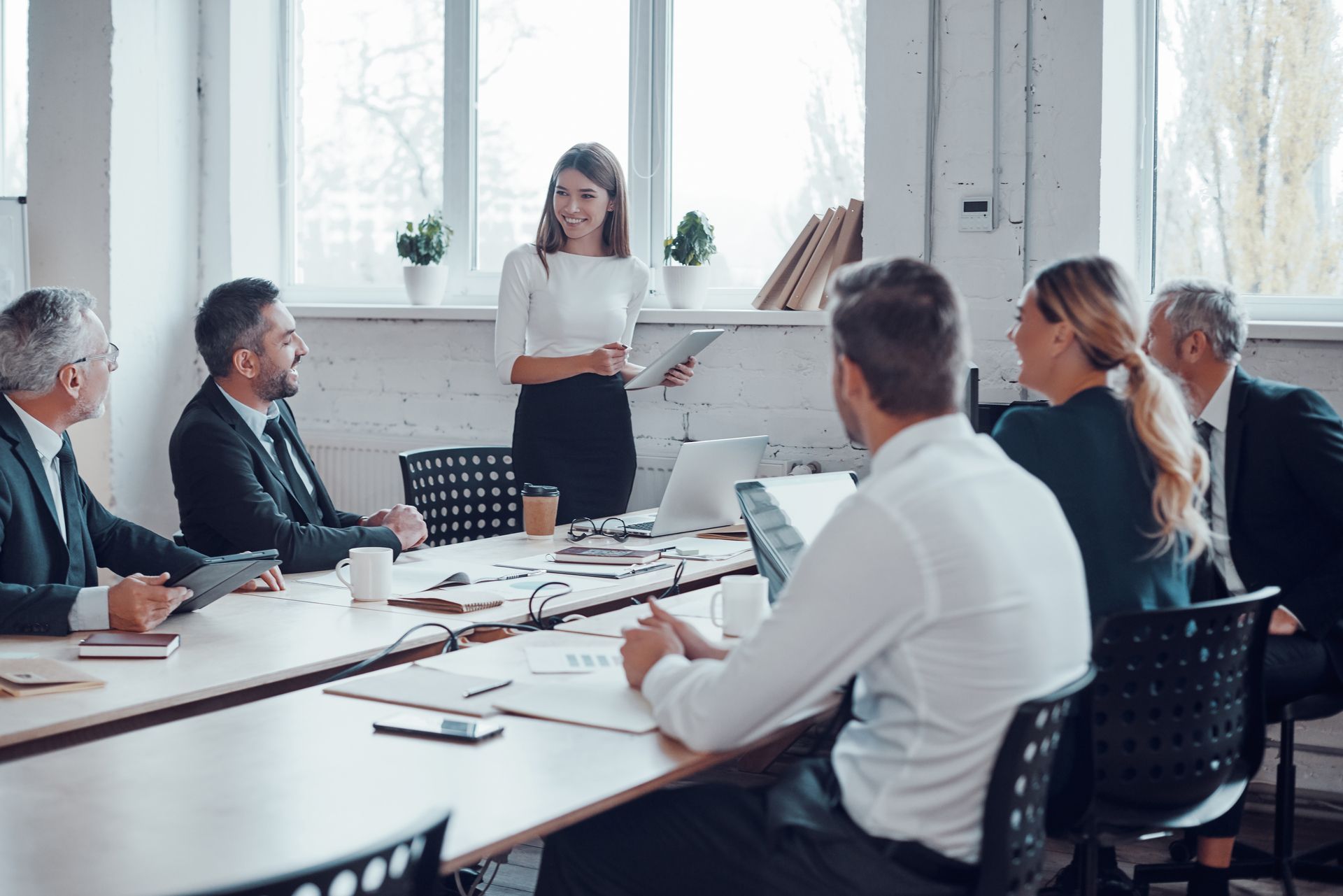 A man is giving a presentation to a group of people.