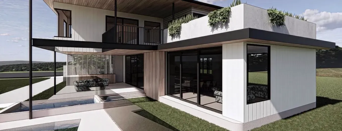 Modern white house with a flat roof, large windows, and green landscaping — Escarpment Building in Austinmer, NSW