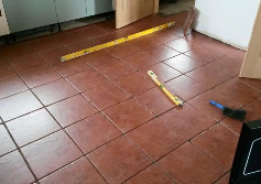 kitchen floor tiles being installed