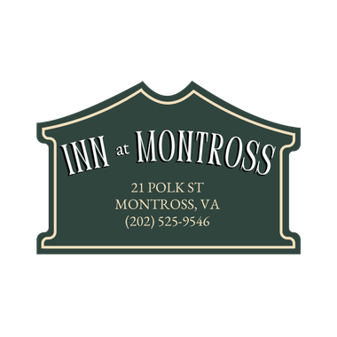 Sign for Inn at Montross, a green and cream colored plaque with text for address and phone number.