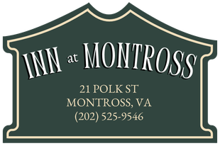 Sign for Inn at Montross in Montross, VA; features address and phone number, dark green with white text.
