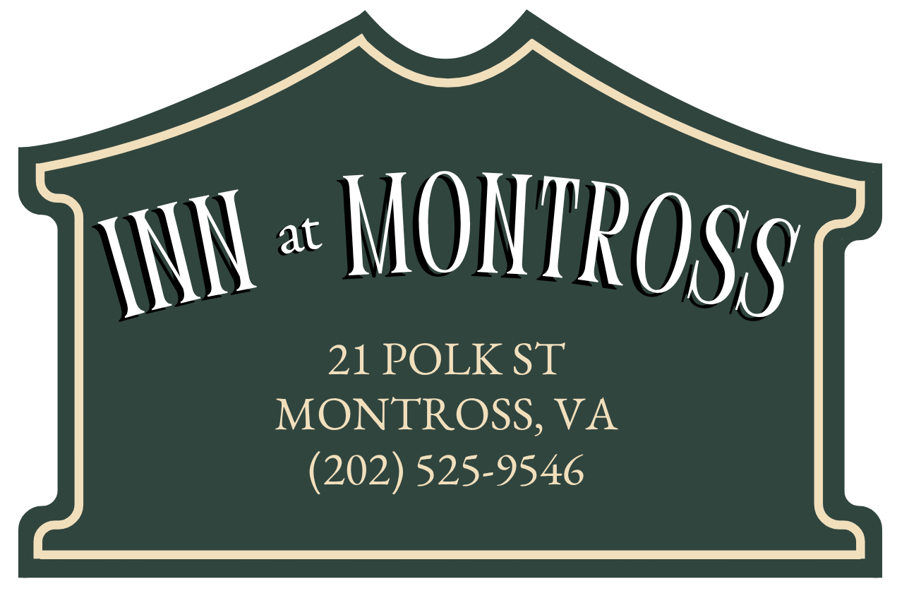 Sign for Inn at Montross in Montross, VA; green with cream border and text.