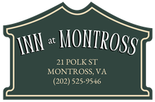 Sign for Inn at Montross in Montross, VA; green with cream border and text.