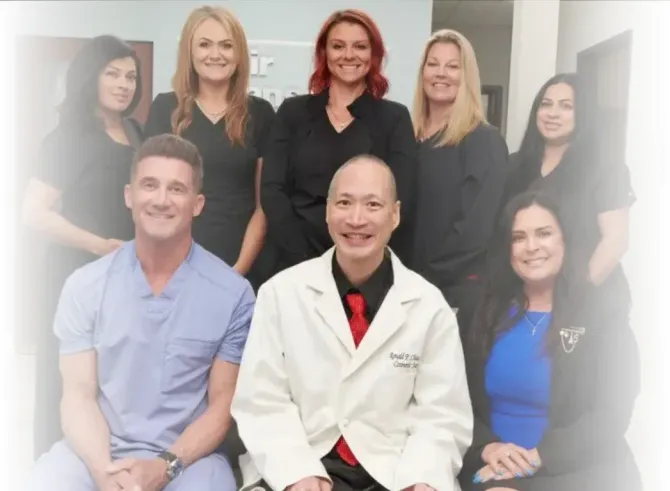 A group of doctors and nurses posing for a picture