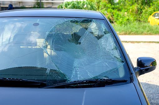 A car with a broken windshield