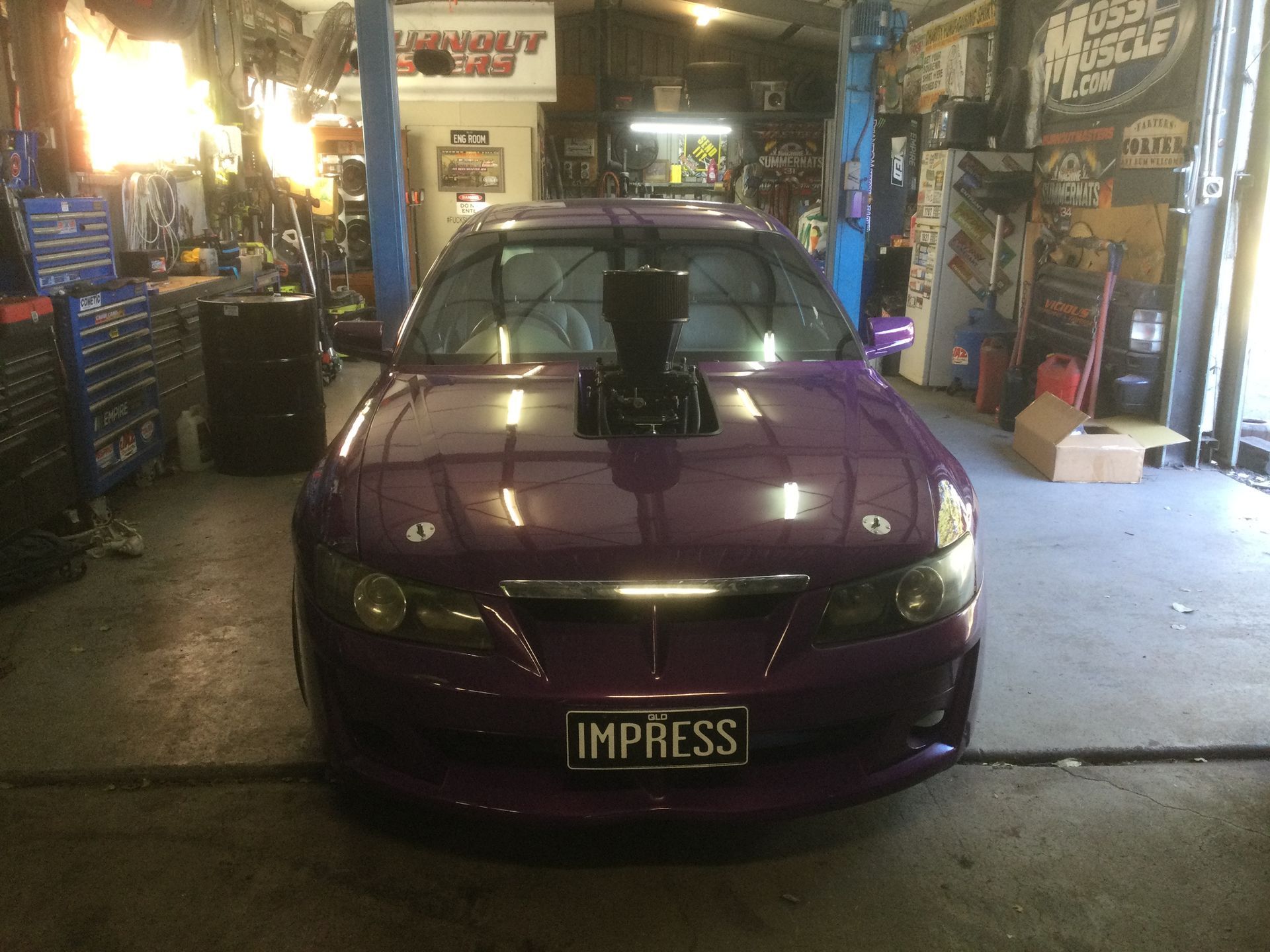 A man is driving a truck on a bridge.