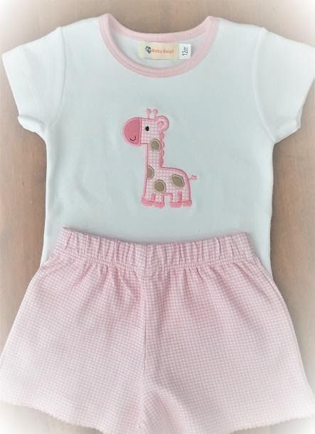 A white shirt with a pink giraffe embroidered on it