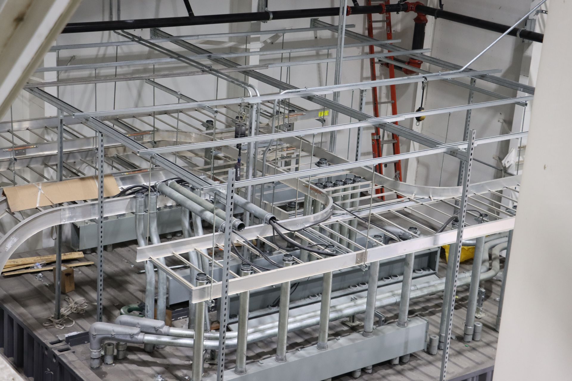 a large metal structure is being built in a building