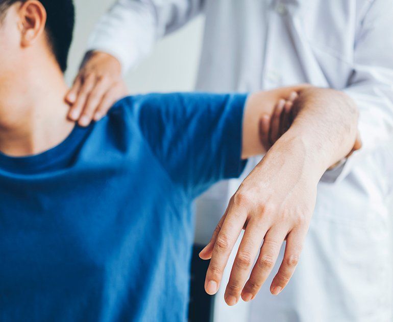 Physical Doctor Consulting With Patient — Opelika, AL — Meals Chiropractic Clinic
