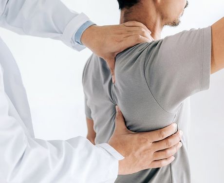 Treatment On Man's Back — Opelika, AL — Meals Chiropractic Clinic