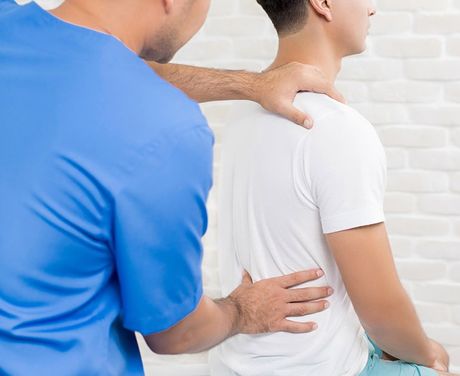 Therapist Treating Lower Back Pain — Opelika, AL — Meals Chiropractic Clinic