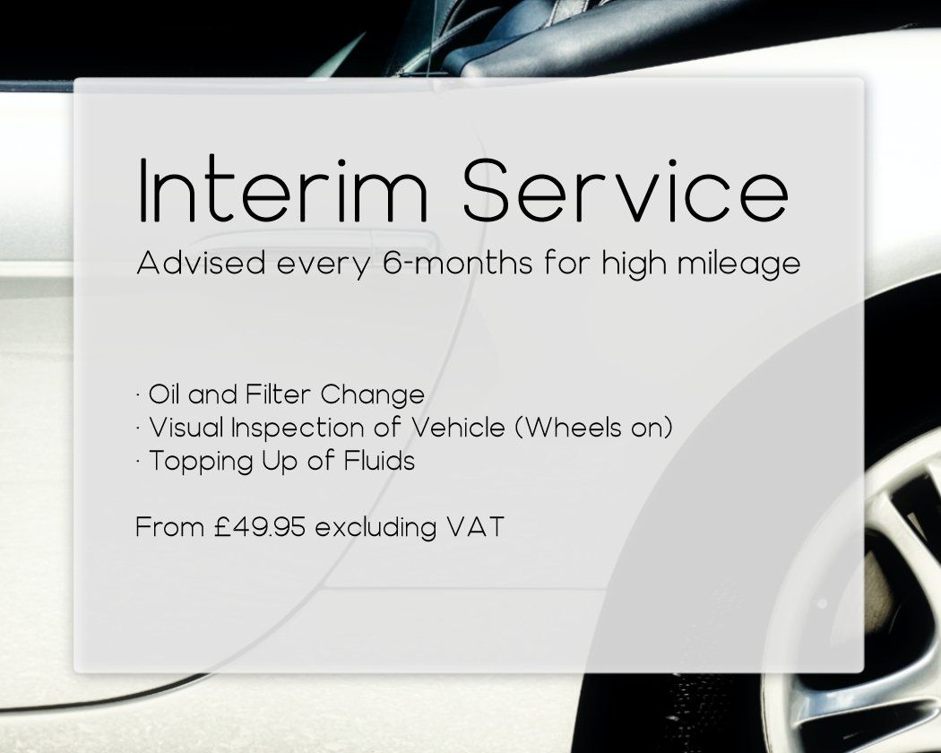 A white car with a sign that says interim service