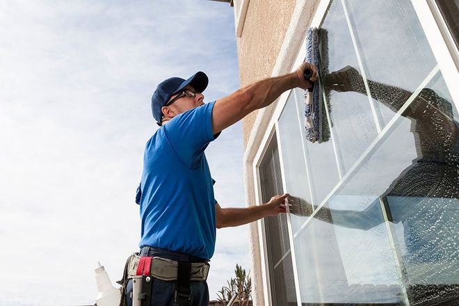 Man Cleaning Window — Omaha, NE — Linden Cleaning Service LLC