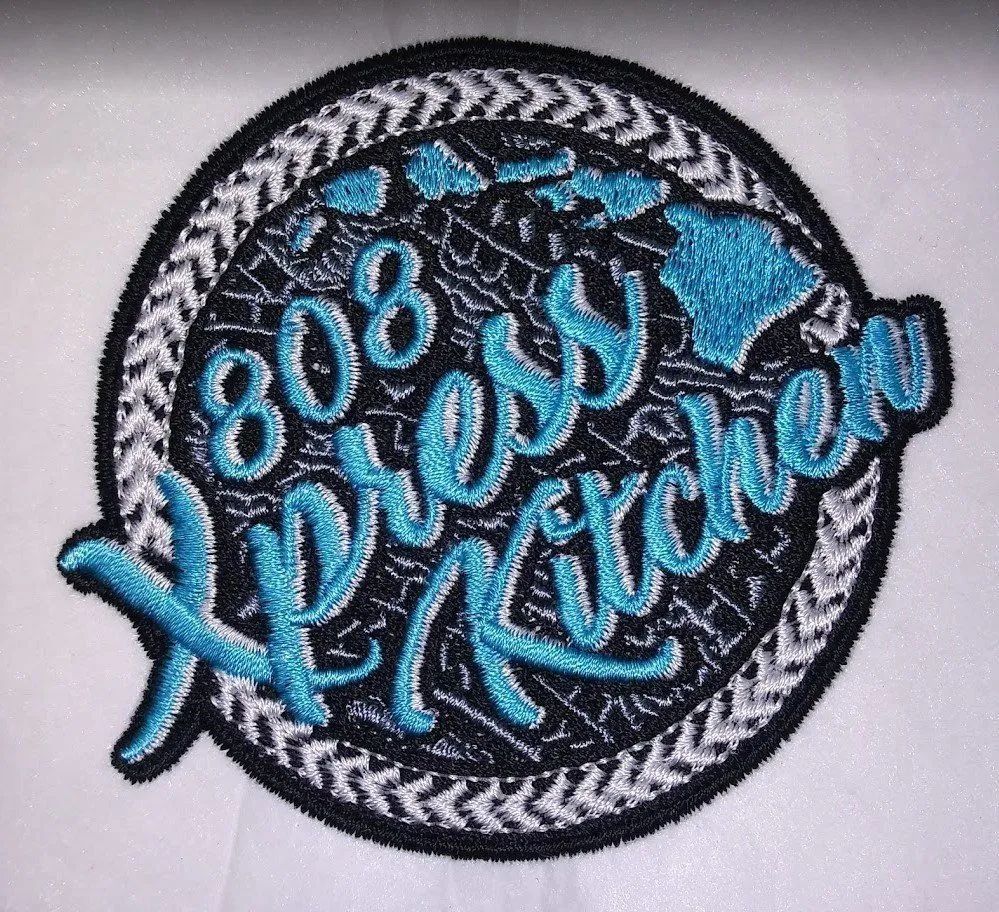 A patch that says 808 cross kitchen on it