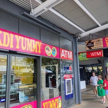 A store front with a sign and an atm — Cairns Custom T-Shirts In Cairns City, QLD