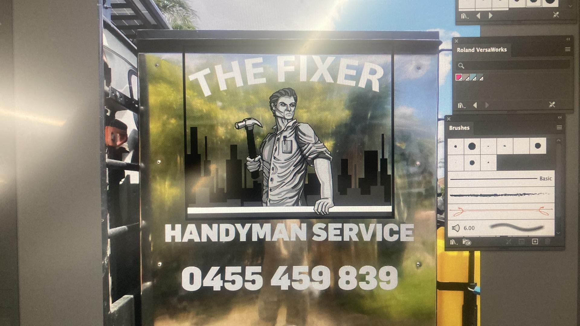 A sign for the fixer handyman service is on a wall — Cairns Custom T-Shirts In Cairns City, QLD